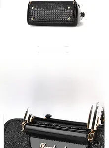 Detail of black faux crocodile leather handbag with polished gold hardware and studs