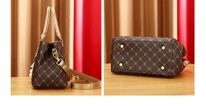 Detail of printed handbag with gold protective metal feet and adjustable strap