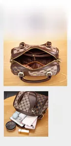 Detailed interior view of a brown monogram Boston bag showing spacious storage capacity