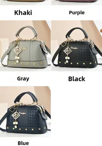 Detail view of stylish crossbody handbags with pearl charms and litchi grain texture