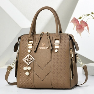 Brown leather Boston handbag with gold hardware, pearl charm and detachable shoulder strap