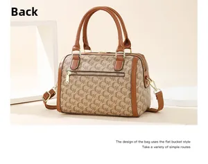 Back view of classic Boston handbag with letter monogram print and metal zipper pocket