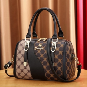 Minimalist brown and black contrast tote bag with monogram texture and gold hardware