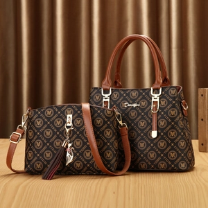 Brown 2-piece tote and crossbody bag set with logo print and cat tassel charm