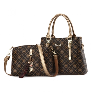 Brown monogram 2-piece tote and crossbody bag set with gold hardware and charms