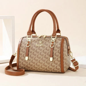 Classic monogram Boston bag with brown leather trim and adjustable crossbody strap