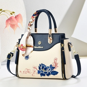 Elegant Chinese style navy and white handbag with blue floral embroidery and scarf detail