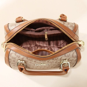 Internal view of brown monogram Boston bag showing spacious compartments and zippers