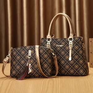 Brown monogram PU leather two-piece handbag set with golden hardware and tassel charm