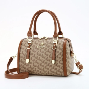 Classic brown monogram handbag with leather trim and gold hardware in front view