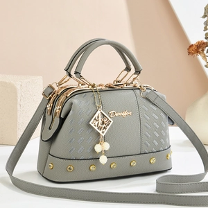 Elegant grey pearl charm handbag with pebbled leather texture and gold hardware details