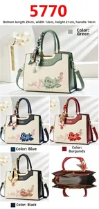 Detailed view of four colorful embroidered handbags with precise dimensions 29x12x21cm