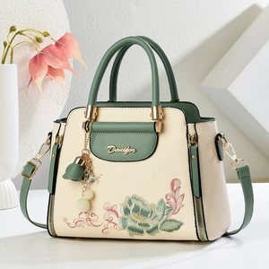 Beige and green embroidered floral handbag with pearl tassel and adjustable strap