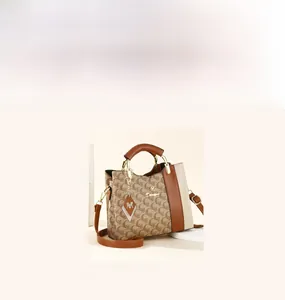 Detail of multi-color tote bag with adjustable shoulder strap and premium gold hardware