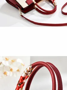 Detail der rot-cremefarbenen Sticktasche mit Seidentuchgriff und Goldschnalle