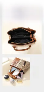 Detail view of large tote interior pockets and multi-compartment storage for daily items