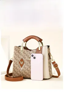 Detail view of large tote bag with mobile phone for size reference and scale