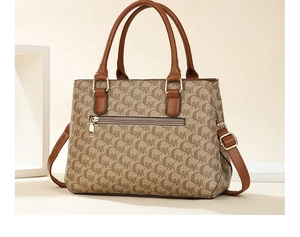 Detail of a brown leather and monogram canvas handbag featuring a back zipper pocket