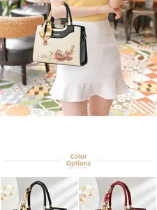 Detailed view of traditional Chinese embroidery and silk scarf handle on women tote bag