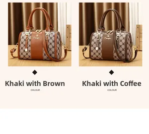 Close-up of stylish printed Boston bags in khaki brown and coffee with golden hardware