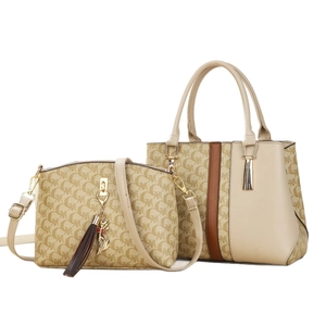 Two-piece beige monogram tote and crossbody bag set with brown trim and cat charm
