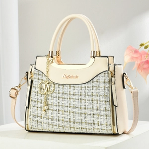 Chic beige woven tweed handbag with gold hardware and detachable shoulder strap