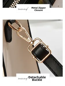 Détails de la fermeture éclair dorée et de la boucle amovible du sac à main chic
