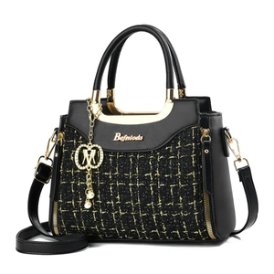 Fashion woven tweed handbag with gold logo and pearl charm in front view