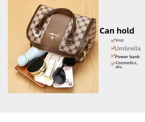 Top view of Boston handbag interior showing capacity for umbrella, phone and iPad