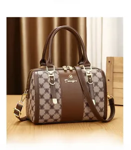Classic Boston pillow bag with brown monogram print and golden metal logo detail