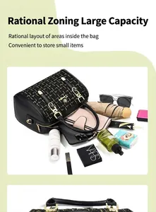 Detail showing the large capacity and organized compartments of the black tweed handbag