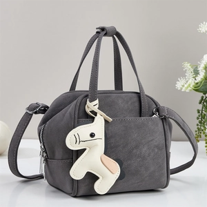 Dark grey matte crossbody bag with cute pony charm and twin handles for daily commute