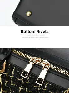 Detail view of black tweed bag showing bottom rivets and high-quality gold metal dual zippers