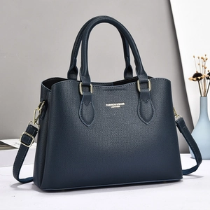 Large dark blue pebble leather tote bag with gold hardware and removable shoulder strap