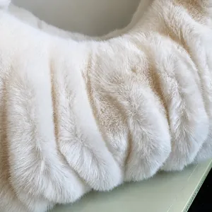 Macro detail of high-quality fluffy white faux fur fabric with soft plush texture