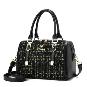 Elegant black tweed Boston handbag with gold stitching and leather straps for women
