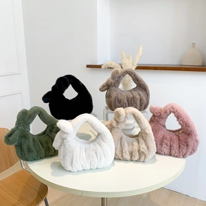 Chic plush faux fur handbag with knotted handle and pleated texture in various colors
