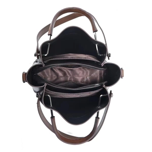 Detailed interior of dark brown leather tote showing multiple pockets and textile lining