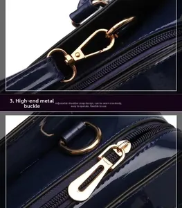 Close-up of golden metal hooks and adjustable strap on dark blue patent leather bag