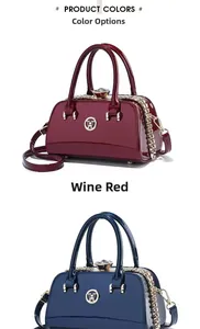 Detail view of glossy patent leather Boston bags with jewel clasp and W metal emblem