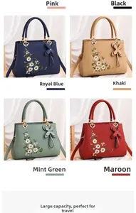 Detail view of embroidered handbags in dark blue, khaki, green, and red color options