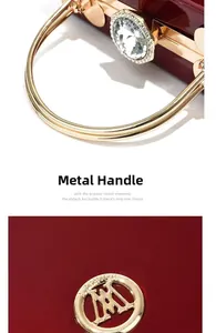 Detailed view of the red glossy patent leather clutch with a gold metal handle