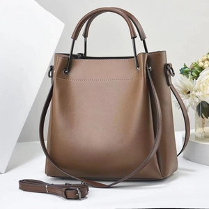 Vintage dark brown pebble leather tote bag with round handles and adjustable shoulder strap