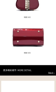 Detail view of burgundy glossy patent leather bag with gold protective bottom studs