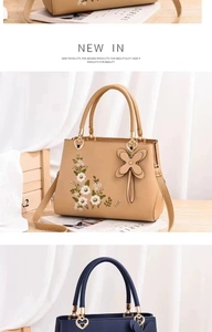 Macro detail of Chinese style floral embroidery on khaki and navy tote handbags