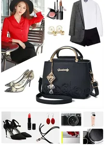 Détail du sac seau noir style chinois avec relief rose 3D et poignées en métal doré