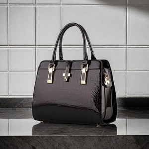Glossy black crocodile pattern tote bag with gold hardware and top handles for women