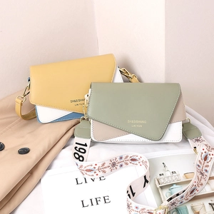 Fashionable color-block crossbody bag with geometric flap and embroidered wide strap