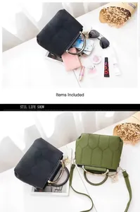 Detail view of stylish crossbody bags with hexagon stitching and metal round handles