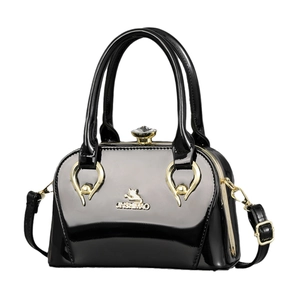 Glossy black patent leather handbag with gold logo and crystal knob closure